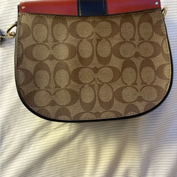 COACH Georgie Saddle Crossbody Bag colorblock signature canvas with rivets.